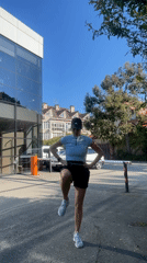 Woman exercises outdoors in sunny Sochi, Russia midday