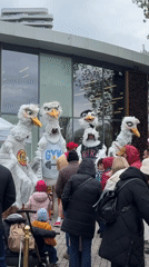 Large bird puppets perform at outdoor event in Burgas