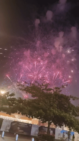 Fireworks display over Phú Quốc, Vietnam, seen from street level