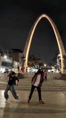 Night dancers perform in Tacna plaza, captured on video