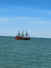 Pirate ship with passengers spotted sailing near mountainous coast