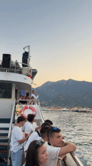 Boat party off the Greek coast, late summer evening