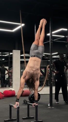 Indoor fitness routine and cat interactions documented in Mengwi
