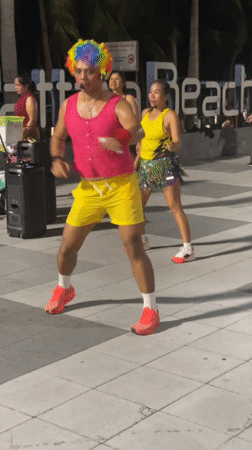 Zumba-style fitness class on Pattaya Beach at night