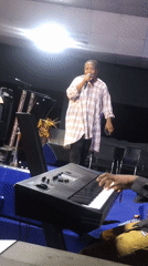 Live musical performance featuring vocals, keyboard, drums in Onitsha