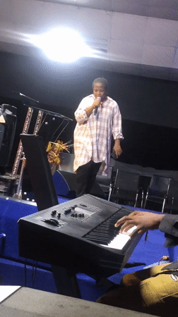 Live musical performance featuring vocals, keyboard, drums in Onitsha