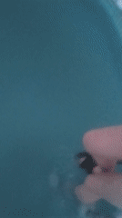 Woman in pink swimsuit braves snow for pool dip