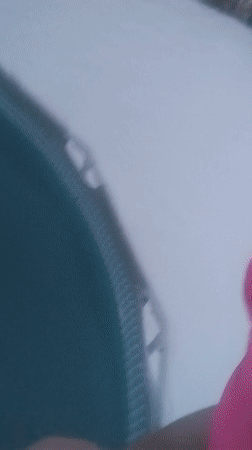 Woman in pink swimsuit braves snow for pool dip