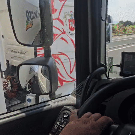 Truck cab perspective driving through Trouillas, France