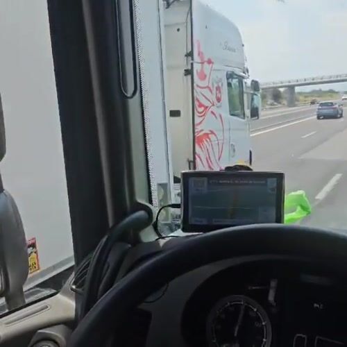 Truck cab perspective driving through Trouillas, France
