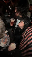 Nighttime crowd gathering captured on video in Buenos Aires