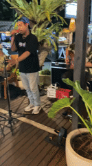 Live music performance captured at Bali restaurant patio