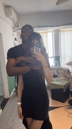 Couple takes mirror selfies in Liangjiang apartment