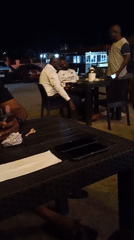 Evening gathering at outdoor venue in Lokoja, Nigeria