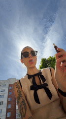 Woman in sunglasses spotted looking skyward in Pleven