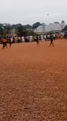 Pickup soccer on a dirt field in Tudun Nupawa, Nigeria.