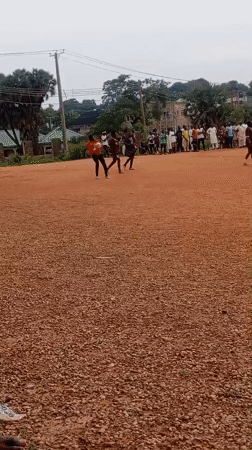 Pickup soccer on a dirt field in Tudun Nupawa, Nigeria.