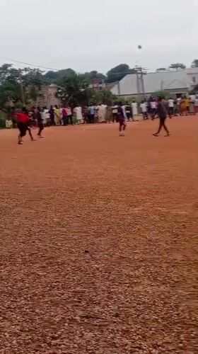 Pickup soccer on a dirt field in Tudun Nupawa, Nigeria.