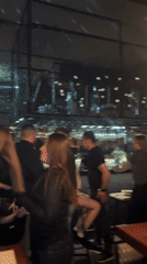 Evening social gathering captured at Novosibirsk bar