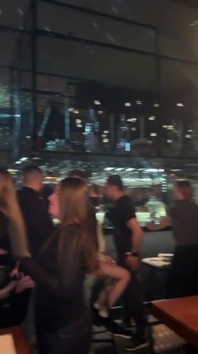 Evening social gathering captured at Novosibirsk bar