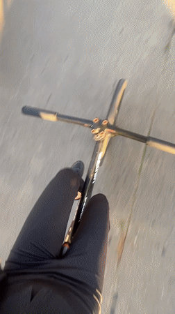 Two cyclists spotted on Monte Grande street during sunlit evening