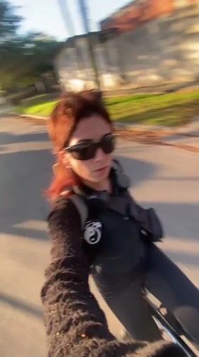 Two cyclists spotted on Monte Grande street during sunlit evening