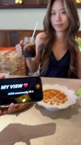 Diner films meal companion at Yuzhong District restaurant