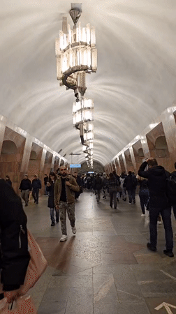 Morning commuters navigate Moscow Metro stations during rush hour