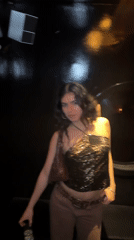 Woman poses for photo at London party