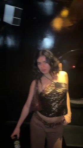 Woman poses for photo at London party