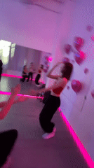 Dance session captured at neon-lit Saint Petersburg studio