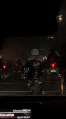 Motorcyclists gather at Jakarta traffic light during evening rush