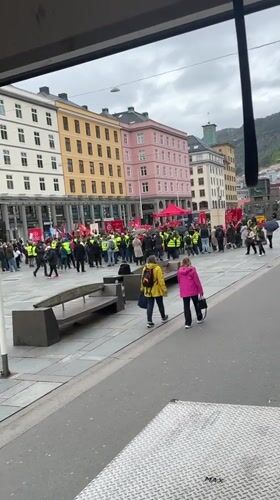 Yellow vest protesters gather with signs in Bergen square