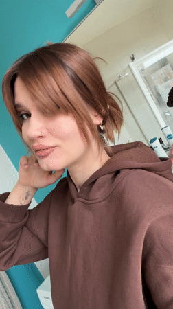 Woman takes bathroom selfies in Antwerp using cartoon-cased iPhone