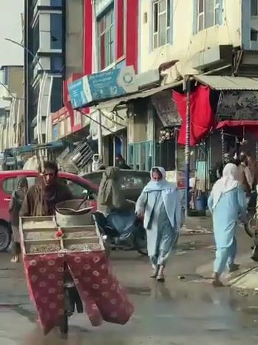 Daily life continues on wet Kandahar streets after rain