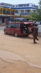 Overloaded cargo vans and street commerce in Nigerian towns