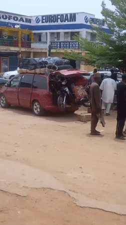 Overloaded cargo vans and street commerce in Nigerian towns