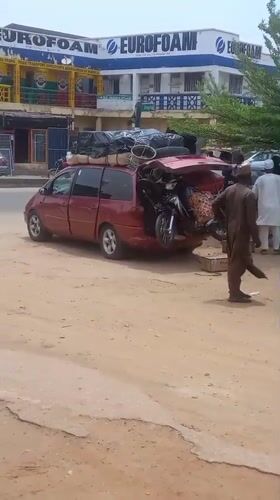 Overloaded cargo vans and street commerce in Nigerian towns