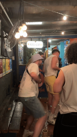 Men dance and socialize at São Paulo bar early Monday