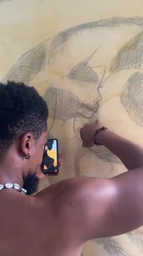 Artist creates large-scale drawing in Ado studio session