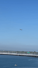 Aircraft observed flying over coastal bridge near Kuta, Indonesia