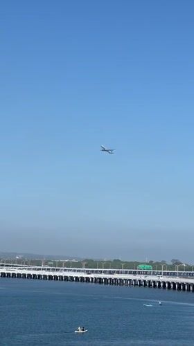 Aircraft observed flying over coastal bridge near Kuta, Indonesia