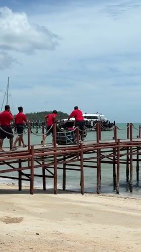 Early morning pier work and a coffee break in Ko Samui