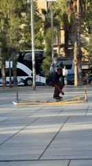Skateboarders perform tricks in Barcelona plaza during afternoon session