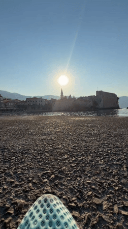 Sunset splash into the Adriatic off Budva's castle coast