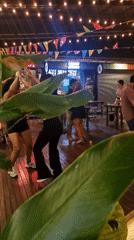 Evening dance gathering at outdoor venue in Ban Rak