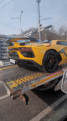 Yellow Lamborghini towed on flatbed truck in Incheon