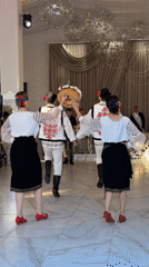 Traditional circle dancing at a Moldovan wedding reception