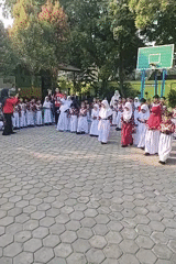 School assembly brings students together in a courtyard ceremony