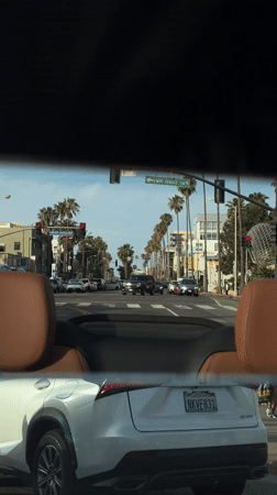 White Lexus stops at red light on Santa Monica street